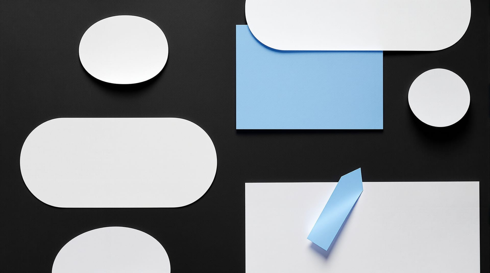Cut paper ovals casting hard shadows with one blue shape ending in a tapering wedge
